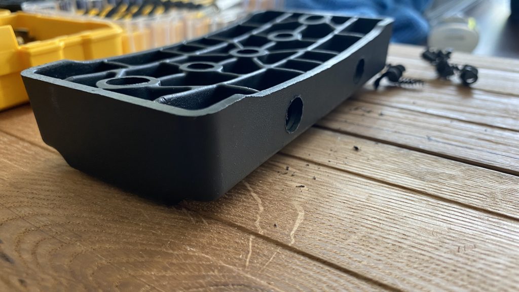 Base block left over from my roof rack. Glued and screwed and drilled holes for bungies